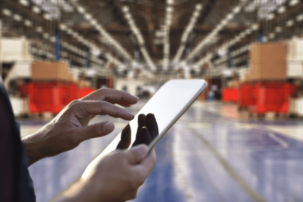 Man using tablet in warehouse